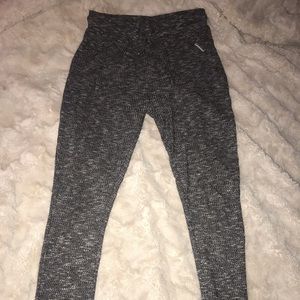 Gymshark black marl leggings and matching hoodie set.